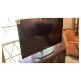 52 inch Samsung flatscreen TV with swivel stand