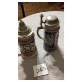To German beer steins, both have pewter lids,