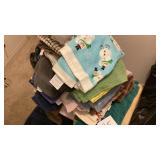 Several towels, washcloths, dish cloths, also