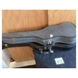 Two Guitar-Shaped Hard Cases