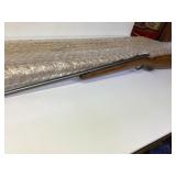 Vintage Bolt-Action Rifle With Wood Stock