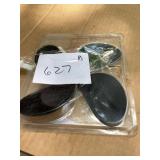 Black Spoon-Shaped Items in Packaging