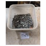 Plastic Bucket Containing Assorted Nails