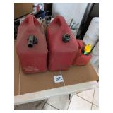 Three Red Plastic Gas Cans