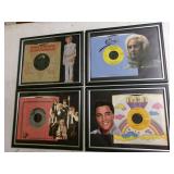 Four framed 45 RPM records w/pcs