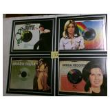 Four framed 45 RPM records w/pcs