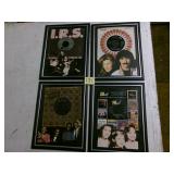 Four framed 45 RPM records w/pcs