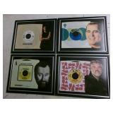 Four framed 45 RPM records w/pcs