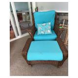 Wicker chair with footstool and seat cushions