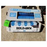 Sewer hose and awning tie down system