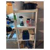 Small plastic stackable shelves with contents