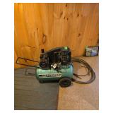 Speedaire air compressor and hose