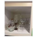 Covered above refrigerator more glassware