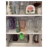 Coffee cups, Candy, dishes, glass pitchers, old oil, lamp, napkin holder, more pictures, vases, or wine, whiskey, and Brandy holders
