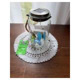 Solar glass jar with butterflies