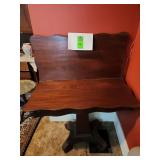 vintage wooden bench or settee, possibly made of cherry wood