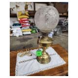 antique Victorian brass oil lamp with an etched glass globe shade