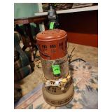 Antique kerosene heater converted into a lamp