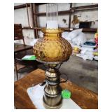 vintage amber quilted glass hurricane table lamp with a brass finish.