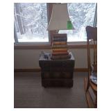 "Stack of books"Side table with lamp