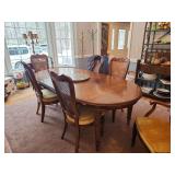 Table and six chairs with two leaves and tabletop protector