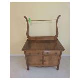 antique oak washstand with a towel bar,