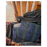 Assorted luggage, garment bags, and ruffles.