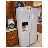 Whirlpool side by side refrigerator with ice maker and water dispenser