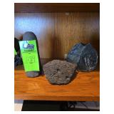 3 rock figurines, 1 lava rock, 1 fashioned into a candle holder