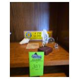 Vietnam veterans bumper sticker, seashell, small glas bear figurine, fish fossil, slide across magnifier, and Sailboat bone knicknack