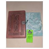 Blank leather case journal and clay frog wall decor