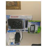 Large display atomic clock, acu-rite thermometer, and doorbell security camera