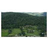 Aerial view of 32± acre property and 6,000+ square