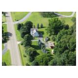 Overhead view of large residential property with l