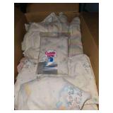 Box of baby/toddler items and toddler sled. Toy baby doll cradle, crib bumper