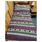 Wooden twin bed frame with mattress, box spring, and rustic bear comforter set