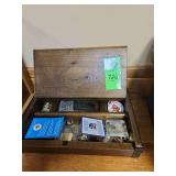 Wood box with pins and belt buckles