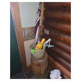 Wooden barrel planter and umbrellas