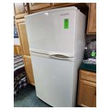 KitchenAid top-freezer refrigerator featuring contoured doors and integrated handles