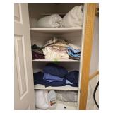 Contents of linen closet. Assorted bedding