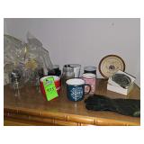 Miscellaneous cups, door knocker, leather gloves and wall decor