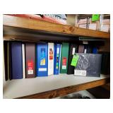 Row of miscellaneous binders