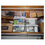 Contents of closet shelf, all sizes of light bulbs