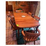 Table with two leaves and eight chairs (only 7 are showing in pictures but there is 8)