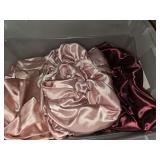 Tote of satin pillow cases and 2 satin sheets. Extra long twin