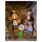 To clay figurines about 12 in tall