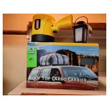 Coleman spotlight, Axius rooftop cargo carrier, and mini lantern