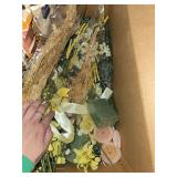 Box of artificial flowers and wedding decor