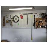 Saw clamps paint brushes miscellaneous items everything on the pegboard
