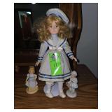 Set of 3 porcelain doll figurines.